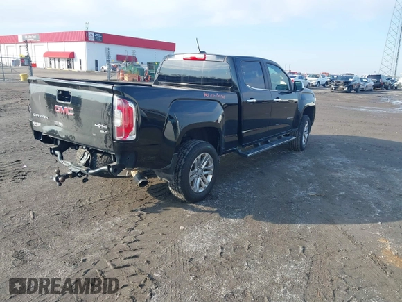 2015 GMC Canyon 4WD SLT with VIN 1GTG6CE34F1153369, listed as a IAAI auction lot 41277810 with 135,821 mi miles. Bid and sale history available at carsss.com. Image 4.