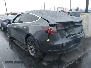 2018 Tesla Model 3 Long Range Battery with VIN 5YJ3E1EB1JF149423, listed as a IAAI auction lot 41896090 with 158,787 mi miles and . Bid and sale history available at DreamBid. Image 3.