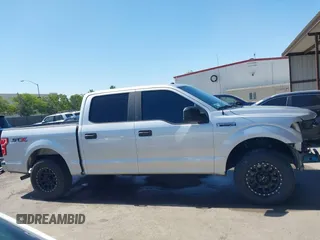 2018 Ford F-150 XL with VIN 1FTEW1CP6JKF36573, listed as a IAAI auction lot 42314415 with 121,240 mi miles and . Bid and sale history available at DreamBid. Image 14.