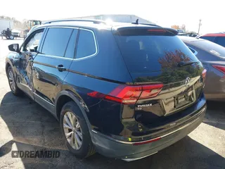 2018 Volkswagen Tiguan SEL z VIN 3VV2B7AX9JM142564, wystawiony jako IAAI lot #40630666 z przebiegiem 86 040 mil mil oraz . Historia ofert i sprzedaży dostępna na DreamBid. Obrazek 3.