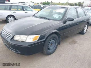 2000 Toyota Camry CE with VIN JT2BG22KXY0499280, listed as a IAAI auction lot 42075329 with 321,420 mi miles. Bid and sale history available at carsss.com. Image 2.