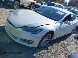 2016 Tesla Model S 70 with VIN 5YJSA1E16GF164264, listed as a IAAI auction lot 40976293 with 68,940 mi miles and . Bid and sale history available at DreamBid. Image 2.