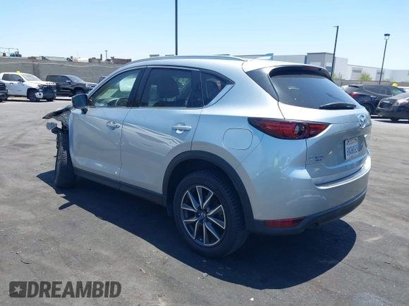 2018 Mazda CX-5 Grand Touring with VIN JM3KFBDM3J0343782, listed as a IAAI auction lot 42527044 with 60,180 mi miles and . Bid and sale history available at DreamBid. Image 3.