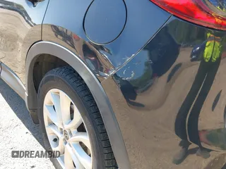 2013 Mazda CX-5 Grand Touring with VIN JM3KE4DE6D0127601, listed as a IAAI auction lot 42143558 with 95,719 mi miles and . Bid and sale history available at DreamBid. Image 17.
