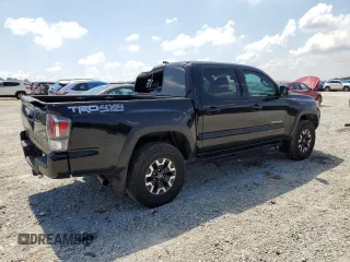 2023 Toyota Tacoma SR with VIN 3TMCZ5AN3PM571922, listed as a Copart auction lot 61872775 with 34,501 mi miles and Salvage title. Bid and sale history available at DreamBid. Image 3.