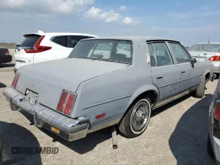 1987 Oldsmobile Cutlass z VIN 2G3GM51Y1H2347545, wystawiony jako Copart lot #76087594 z przebiegiem 98 257 mil mil oraz Szkody całkowita. Historia ofert i sprzedaży dostępna na DreamBid. Obrazek 3.