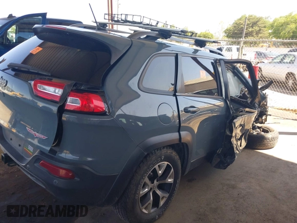 2014 Jeep Cherokee Trailhawk with VIN 1C4PJMBS5EW134900, listed as a IAAI auction lot 41997316 with 96,445 mi miles. Bid and sale history available at carsss.com. Image 4.