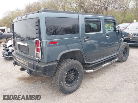 2005 Hummer H2 SUV z VIN 5GRGN23U95H100888, wystawiony jako IAAI lot #41937351 z przebiegiem 202 969 mil mil oraz . Historia ofert i sprzedaży dostępna na DreamBid. Obrazek 4.