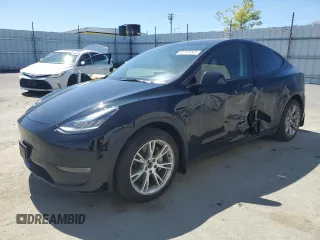 2023 Tesla Model Y Long Range z VIN 7SAYGDEE2PA121439, wystawiony jako Copart lot #51305945 z przebiegiem 31 270 mil mil oraz Szkoda całkowita • Salvage title. Historia ofert i sprzedaży dostępna na DreamBid. Obrazek 1.