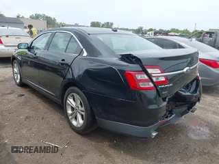 2015 Ford Taurus SEL with VIN 1FAHP2E80FG192017, listed as a IAAI auction lot 42562853 with 124,348 mi miles and . Bid and sale history available at DreamBid. Image 3.
