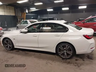 2023 BMW 3 Series 330e xDrive with VIN 3MW39FS05P8D20575, listed as a IAAI auction lot 42076033 with 10,875 mi miles. Bid and sale history available at carsss.com. Image 14.