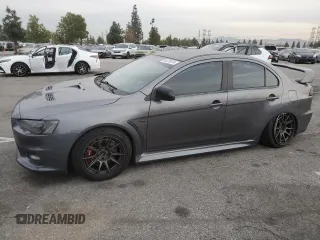 2010 Mitsubishi Lancer Evolution GSR with VIN JA32W8FV1AU027600, listed as a Copart auction lot 84328974 with 88,417 mi miles and Salvage Title. Bid and sale history available at DreamBid. Image 1.