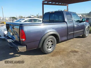 1999 Ford F-150 XL with VIN 1FTRX17L4XKA58054, listed as a IAAI auction lot 41647530 with 225,632 mi miles. Bid and sale history available at carsss.com. Image 4.