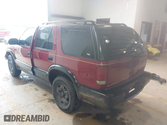 1999 Chevrolet Blazer Trailblazer z VIN 1GNDT13W4X2187490, wystawiony jako IAAI lot #41966073 z przebiegiem 187 604 mil mil oraz . Historia ofert i sprzedaży dostępna na DreamBid. Obrazek 3.
