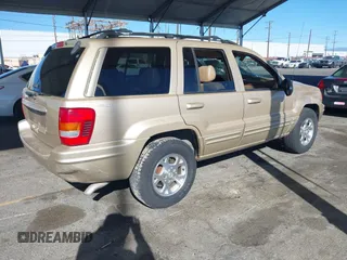 1999 Jeep Grand Cherokee Limited with VIN 1J4GW68NXXC727844, listed as a IAAI auction lot 41290773 with 222,838 mi miles. Bid and sale history available at carsss.com. Image 4.