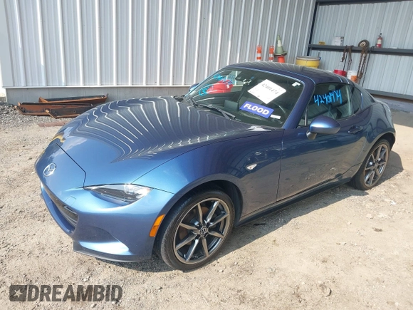 2018 Mazda MX-5 Miata Grand Touring with VIN JM1NDAM71J0201351, listed as a IAAI auction lot 42401474 with 96,054 mi miles and . Bid and sale history available at DreamBid. Image 2.