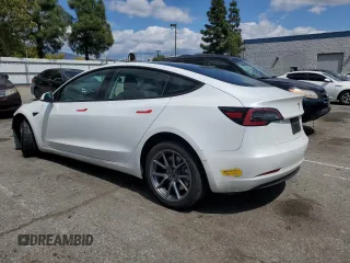 2022 Tesla Model 3 Long Range with VIN 5YJ3E1EB4NF139023, listed as a Copart auction lot 51410345 with 54,789 mi miles and Salvage Title. Bid and sale history available at DreamBid. Image 2.