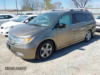 2012 Honda Odyssey Touring with VIN 5FNRL5H9XCB110672, listed as a IAAI auction lot 41826895 with 159,927 mi miles. Bid and sale history available at carsss.com. Image 2.