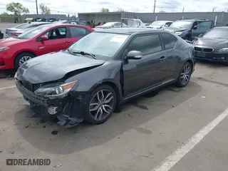 2015 Scion tC with VIN JTKJF5C73FJ008663, listed as a IAAI auction lot 41969395 with 125,758 mi miles. Bid and sale history available at carsss.com. Image 2.