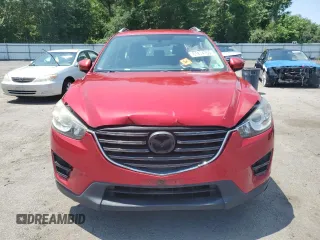 2016 Mazda CX-5 Sport with VIN JM3KE4BY3G0765905, listed as a Copart auction lot 61874165 with 134,546 mi miles and Salvage title. Bid and sale history available at DreamBid. Image 5.