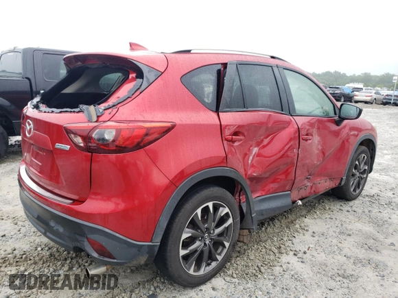 2016 Mazda CX-5 Grand Touring z VIN JM3KE2DY8G0623423, wystawiony jako Copart lot #58599545 z przebiegiem 131 932 mil mil oraz Szkoda całkowita • Salvage title. Historia ofert i sprzedaży dostępna na DreamBid. Obrazek 3.