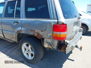 1998 Jeep Grand Cherokee Limited z VIN 1J4GZ88Z4WC328450, wystawiony jako IAAI lot #42652126 z przebiegiem 166 576 mil mil oraz . Historia ofert i sprzedaży dostępna na DreamBid. Obrazek 12.