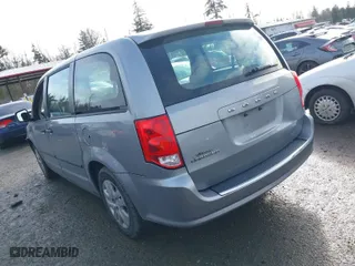 2014 Dodge Grand Caravan SE with VIN 2C4RDGBG7ER131079, listed as a IAAI auction lot 41614495 with 122,925 mi miles. Bid and sale history available at carsss.com. Image 3.