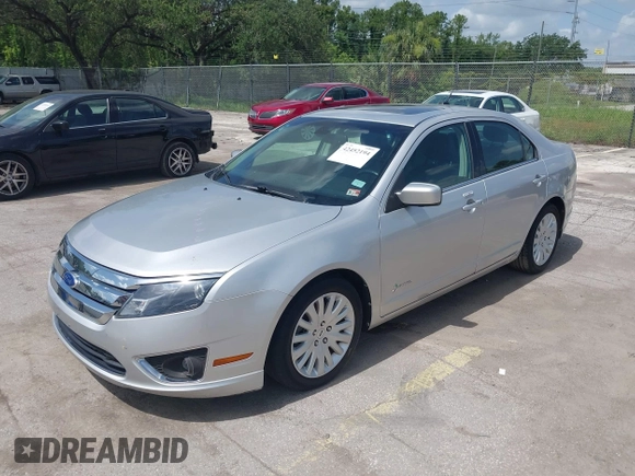 2011 Ford Fusion Hybrid with VIN 3FADP0L38BR249996, listed as a IAAI auction lot 42452194 with 111,316 mi miles and . Bid and sale history available at DreamBid. Image 2.