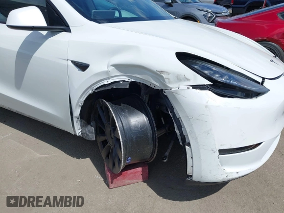 2020 Tesla Model Y Long Range with VIN 5YJYGDEE2LF058515, listed as a IAAI auction lot 41932748 with 62,885 mi miles and . Bid and sale history available at DreamBid. Image 6.