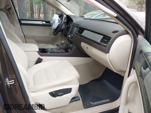 2014 Volkswagen Touareg Sport with VIN WVGEF9BP2ED007904, listed as a IAAI auction lot 41960811 with 126,230 mi miles and . Bid and sale history available at DreamBid. Image 5.
