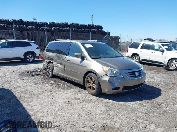 2010 Honda Odyssey Touring with VIN 5FNRL3H9XAB094765, listed as a IAAI auction lot 41892743 with 127,143 mi miles. Bid and sale history available at carsss.com. Image 1.