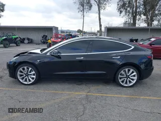 2018 Tesla Model 3 Long Range Battery with VIN 5YJ3E1EA9JF009384, listed as a IAAI auction lot 41544624 with 66,896 mi miles and . Bid and sale history available at DreamBid. Image 14.