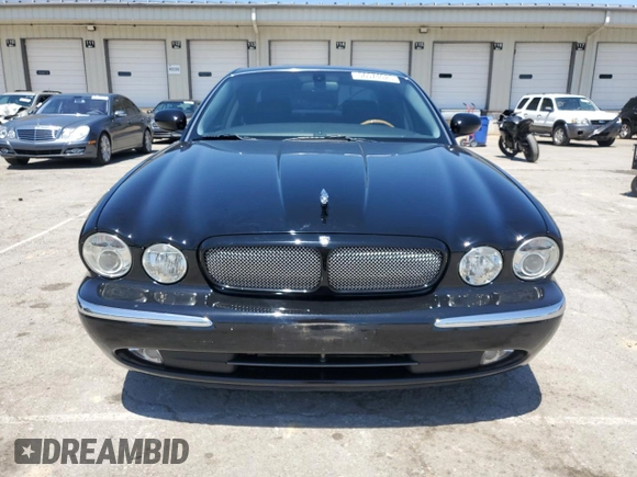 2004 Jaguar XJ с VIN SAJEA73B34TG10749, выставлен на аукционе Copart как лот 56574025 с пробегом 72 240 миль миль и Списание • Salvage title. История ставок и продаж доступна на DreamBid. Изображение 5.
