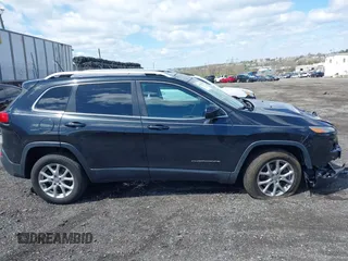 2014 Jeep Cherokee Latitude with VIN 1C4PJMCS8EW257959, listed as a IAAI auction lot 41987529 with 124,749 mi miles. Bid and sale history available at carsss.com. Image 14.
