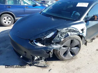 2020 Tesla Model 3 Standard Range Plus with VIN 5YJ3E1EA4LF745491, listed as a IAAI auction lot 41186726 with 74,575 mi miles and . Bid and sale history available at DreamBid. Image 19.