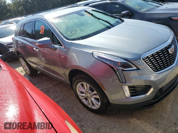 2023 Cadillac XT5 FWD Luxury z VIN 1GYKNAR4XPZ144533, wystawiony jako Copart lot #74734164 z przebiegiem Nie podano mil oraz Nie do naprawy • Non repairable. Historia ofert i sprzedaży dostępna na DreamBid. Obrazek 4.