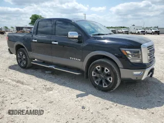 2023 Nissan Titan Platinum Reserve with VIN 1N6AA1EDXPN106467, listed as a Copart auction lot 53455215 with 56,061 mi miles and Salvage title. Bid and sale history available at DreamBid. Image 4.