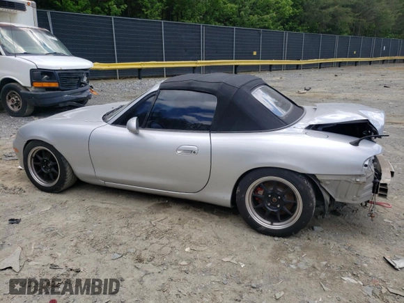 2004 Mazda MX-5 Miata LS with VIN JM1NB353640400140, listed as a Copart auction lot 56127165 with 123,276 mi miles and Salvage title. Bid and sale history available at DreamBid. Image 2.
