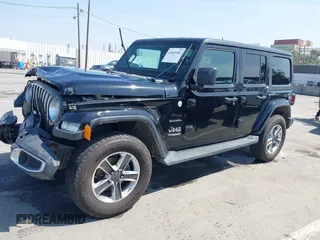 2020 Jeep Wrangler Unlimited Sahara with VIN 1C4HJXEN6LW235159, listed as a IAAI auction lot 42045083 with 68,400 mi miles and . Bid and sale history available at DreamBid. Image 14.