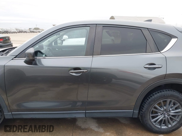 2021 Mazda CX-5 Touring with VIN JM3KFBCM0M0342210, listed as a IAAI auction lot 41236013 with 96,012 mi miles. Bid and sale history available at carsss.com. Image 15.