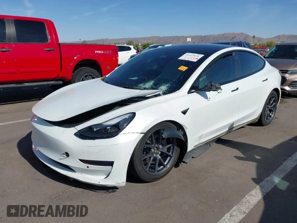 2022 Tesla Model 3 Long Range z VIN 5YJ3E1EB3NF348267, wystawiony jako IAAI lot #42323616 z przebiegiem Nie podano mil oraz . Historia ofert i sprzedaży dostępna na DreamBid. Obrazek 2.