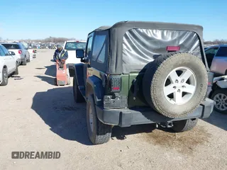 2007 Jeep Wrangler X with VIN 1J8FA24197L205095, listed as a IAAI auction lot 41388452 with 127,051 mi miles and . Bid and sale history available at carsss.com. Image 3.