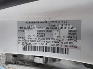 2021 Mazda 3 Preferred z VIN 3MZBPBCL0MM250862, wystawiony jako IAAI lot #42318612 z przebiegiem 86 056 mil mil oraz . Historia ofert i sprzedaży dostępna na DreamBid. Obrazek 9.