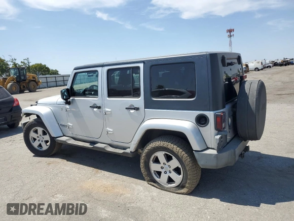 2007 Jeep Wrangler Unlimited Sahara with VIN 1J8GA59137L181360, listed as a Copart auction lot 62311225 with 151,393 mi miles and Salvage title. Bid and sale history available at DreamBid. Image 2.