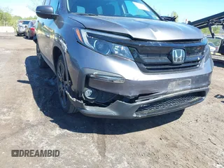 2021 Honda Pilot Special Edition z VIN 5FNYF6H27MB043638, wystawiony jako IAAI lot #42127878 z przebiegiem 50 401 mil mil oraz . Historia ofert i sprzedaży dostępna na DreamBid. Obrazek 6.