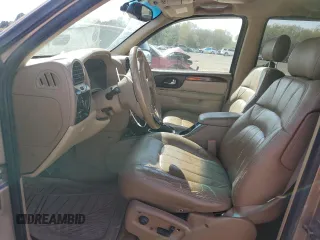 2003 GMC Envoy SLT z VIN 1GKDS13S032134647, wystawiony jako Copart lot #50137325 z przebiegiem 217 878 mil mil oraz Szkody całkowita. Historia ofert i sprzedaży dostępna na DreamBid. Obrazek 7.