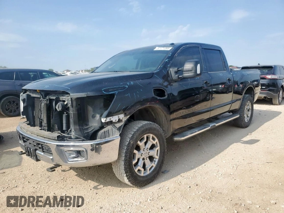 2016 Nissan Titan Platinum Reserve with VIN 1N6BA1F42GN506140, listed as a Copart auction lot 57171395 with 141,295 mi miles and Salvage title. Bid and sale history available at DreamBid. Image 1.