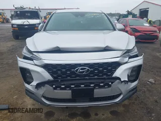 2019 Hyundai Santa Fe SE z VIN 5NMS23AD4KH130517, wystawiony jako IAAI lot #42324854 z przebiegiem 76 963 mil mil oraz . Historia ofert i sprzedaży dostępna na DreamBid. Obrazek 12.