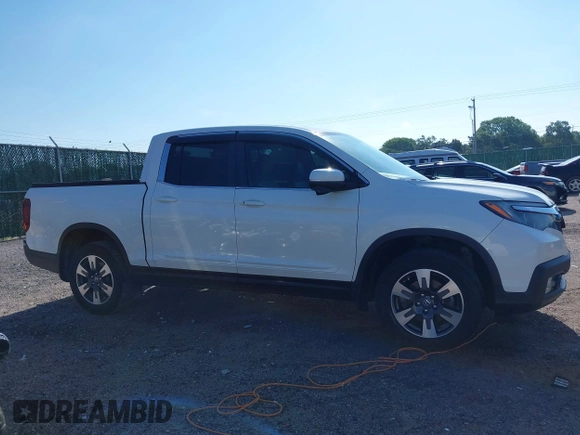 2017 Honda Ridgeline RTL-T z VIN 5FPYK3F69HB038048, wystawiony jako IAAI lot #42583177 z przebiegiem 183 564 mil mil oraz . Historia ofert i sprzedaży dostępna na DreamBid. Obrazek 14.