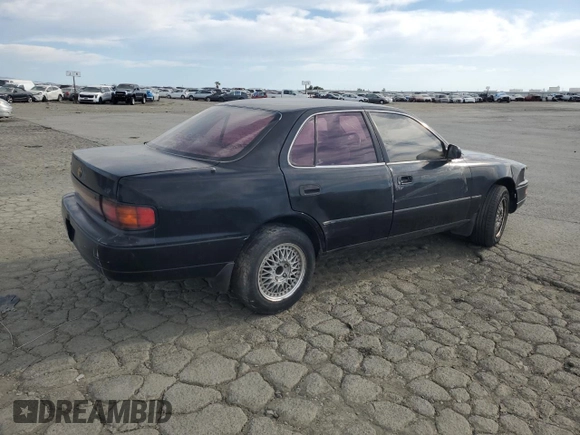 1993 Toyota Camry LE with VIN JT2SK12E4P0112014, listed as a Copart auction lot 52822095 with 249,458 mi miles and Salvage Title. Bid and sale history available at carsss.com. Image 3.